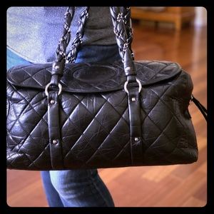 Original Chanel black quilted leather travel bag
